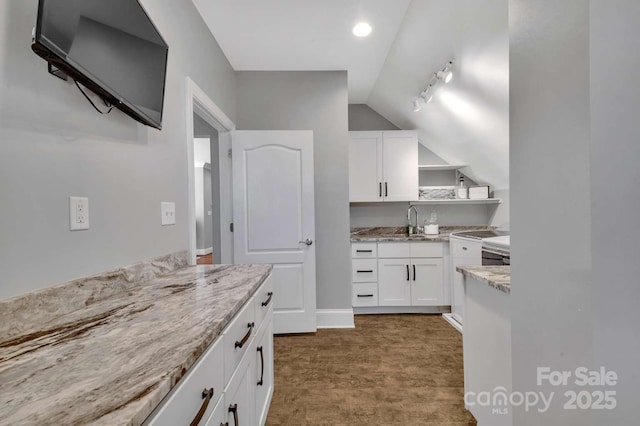 4536 Rustling Woods Dr, Denver, NC 28037 - kitchen with lofted ceiling, light stone countertops, open shelves, a sink, and white cabinetry