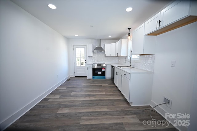 621 Cauthen St, Rock Hill, SC 29730 - kitchen featuring appliances with stainless steel finishes, wall chimney range hood, a sink, decorative backsplash, and white cabinets