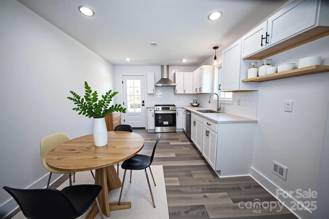 621 Cauthen St, Rock Hill, SC 29730 - kitchen featuring stainless steel appliances, a sink, wall chimney exhaust hood, decorative backsplash, and dark wood-type flooring