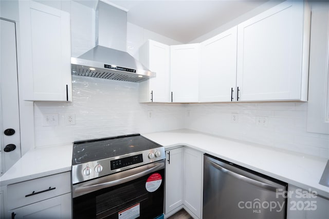 621 Cauthen St, Rock Hill, SC 29730 - kitchen featuring wall chimney range hood, appliances with stainless steel finishes, decorative backsplash, light countertops, and white cabinetry