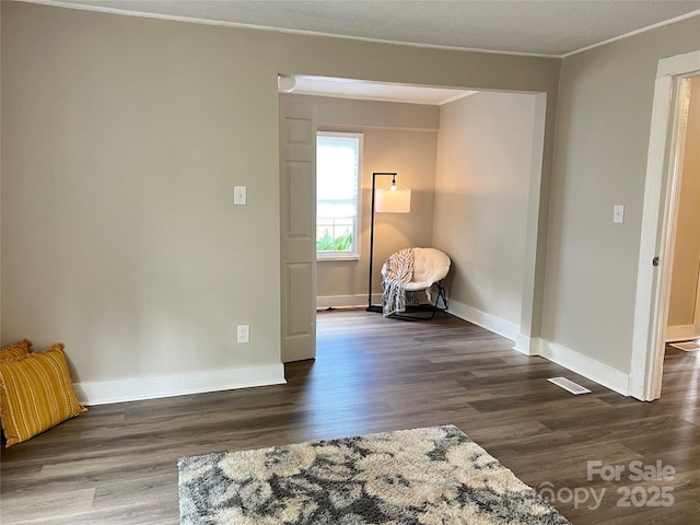 507 E Maple Ave, Gastonia, NC 28054 - living area featuring wood finished floors, crown molding, and baseboards