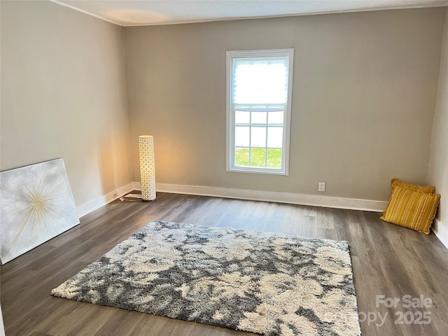 507 E Maple Ave, Gastonia, NC 28054 - unfurnished room featuring baseboards, wood finished floors, and ornamental molding