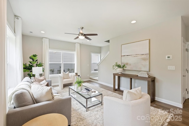 living room featuring baseboards, a ceiling fan, wood finished floors, and recessed lighting