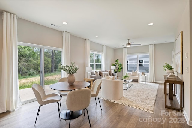 dining space featuring a ceiling fan, light wood-style floors, visible vents, and recessed lighting