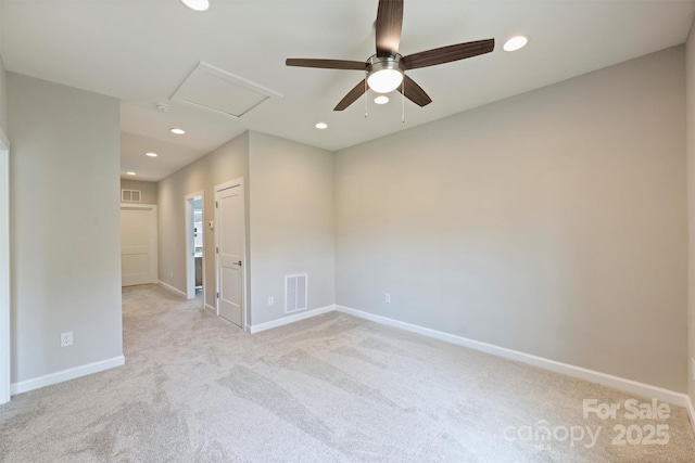 carpeted spare room with a ceiling fan, attic access, baseboards, visible vents, and recessed lighting