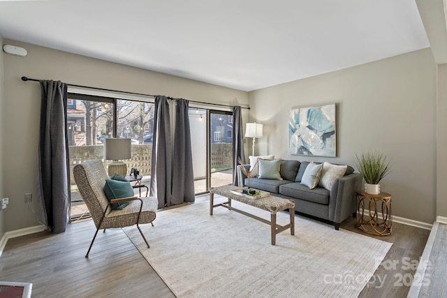 419 W 8th St, Charlotte, NC 28202 - living room with baseboards and wood finished floors
