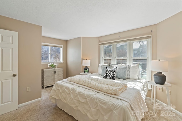 419 W 8th St, Charlotte, NC 28202 - bedroom with baseboards, a textured ceiling, and carpet flooring