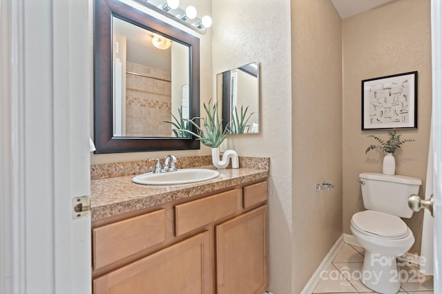 419 W 8th St, Charlotte, NC 28202 - bathroom with baseboards, toilet, vanity, and tile patterned flooring