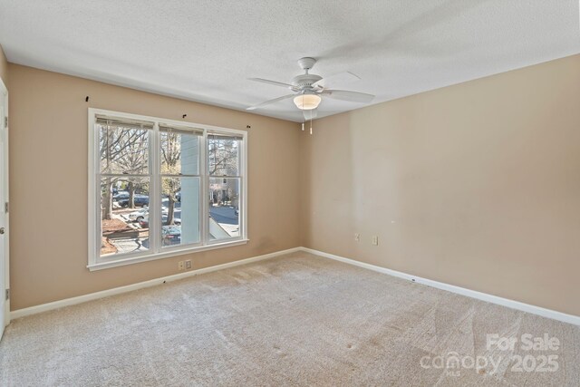 419 W 8th St, Charlotte, NC 28202 - spare room with baseboards, carpet floors, a textured ceiling, and ceiling fan