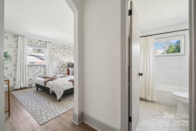 1749 Archdale Dr, Charlotte, NC 28210 - bedroom featuring light wood-style floors and arched walkways