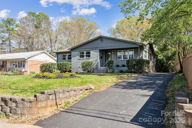 1749 Archdale Dr, Charlotte, NC 28210 - view of front of home featuring stone siding and asphalt driveway