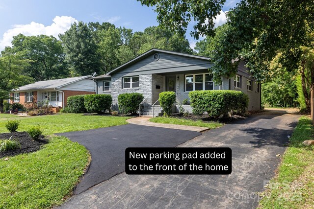 1749 Archdale Dr, Charlotte, NC 28210 - view of front facade with driveway and a front yard