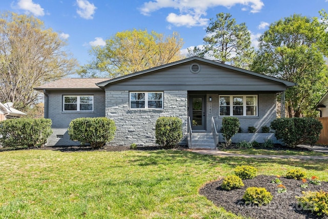 1749 Archdale Dr, Charlotte, NC 28210 - view of front of house featuring a front lawn, a porch, and brick siding