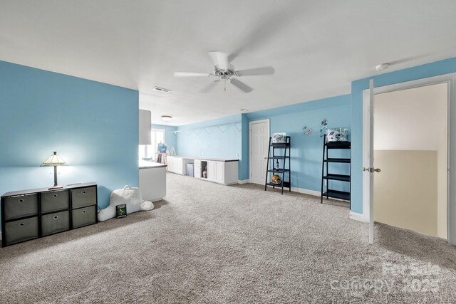 unfurnished bedroom with visible vents, carpet flooring, and a ceiling fan