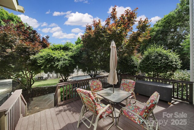 deck with outdoor dining space