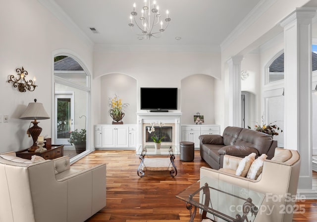 102 Stone Point Ct, Mooresville, NC 28117 - living area with ornate columns, ornamental molding, visible vents, a chandelier, and wood finished floors