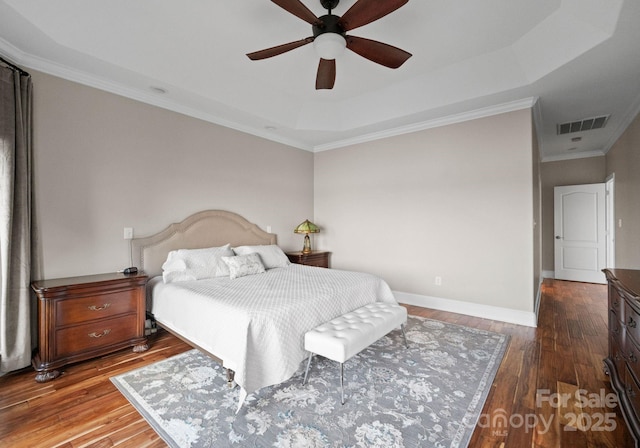 102 Stone Point Ct, Mooresville, NC 28117 - bedroom with visible vents, baseboards, ornamental molding, hardwood / wood-style flooring, and a tray ceiling