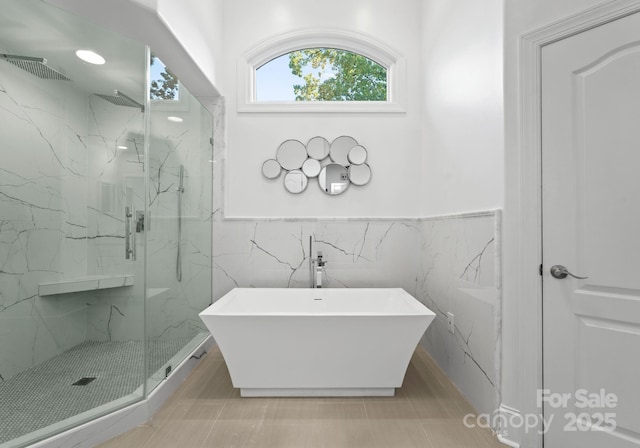 102 Stone Point Ct, Mooresville, NC 28117 - full bathroom featuring a marble finish shower, visible vents, a freestanding bath, and wainscoting