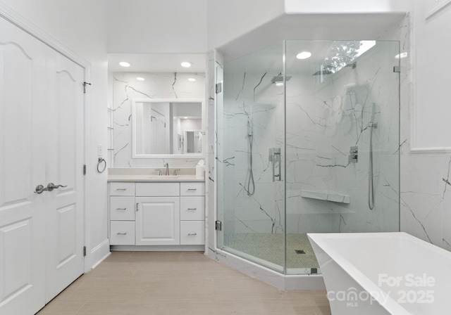 102 Stone Point Ct, Mooresville, NC 28117 - full bath with vanity, a marble finish shower, and a soaking tub