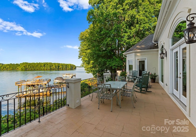 102 Stone Point Ct, Mooresville, NC 28117 - view of patio / terrace with french doors, outdoor dining area, and a water view