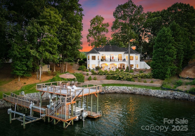 102 Stone Point Ct, Mooresville, NC 28117 - rear view of house with boat lift, a balcony, and a water view