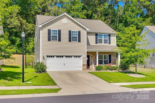 317 Praline Way, Fort Mill, SC 29715 - traditional-style home featuring an attached garage, concrete driveway, a front lawn, and a shingled roof