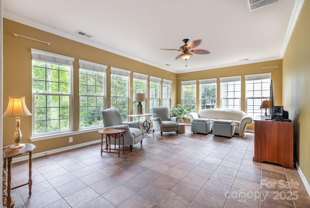 interior space with ceiling fan, a wealth of natural light, and visible vents