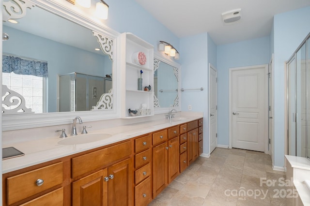 full bath featuring a sink, double vanity, and a stall shower