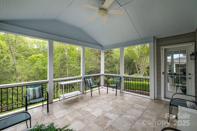 unfurnished sunroom with a ceiling fan