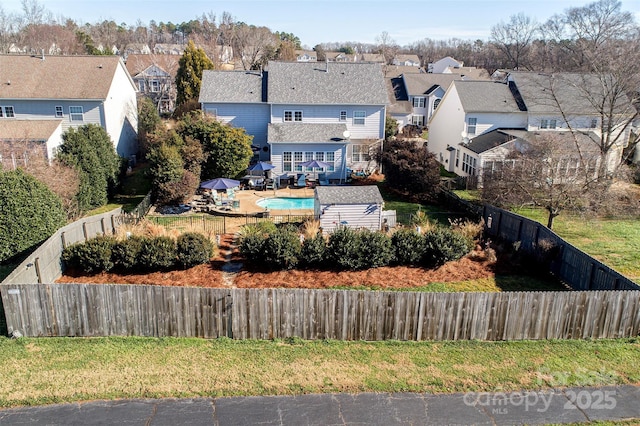 birds eye view of property with a residential view