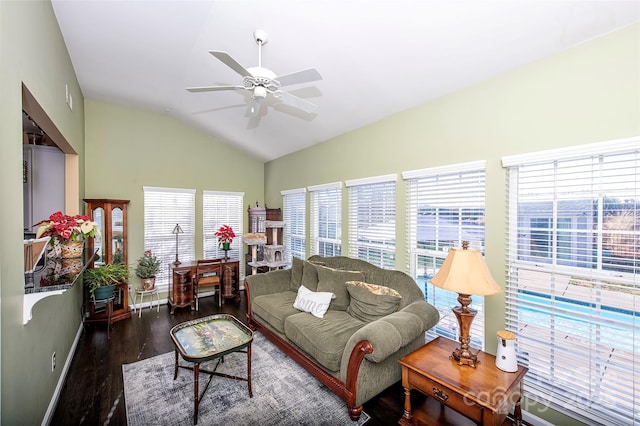 living room with ceiling fan, baseboards, lofted ceiling, and wood finished floors