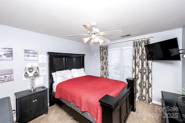 bedroom with light colored carpet, a ceiling fan, visible vents, and baseboards
