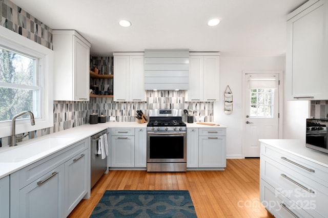 36 Brookcliff Dr, Asheville, NC 28804 - kitchen with tasteful backsplash, a sink, light wood-style flooring, stainless steel appliances, and open shelves