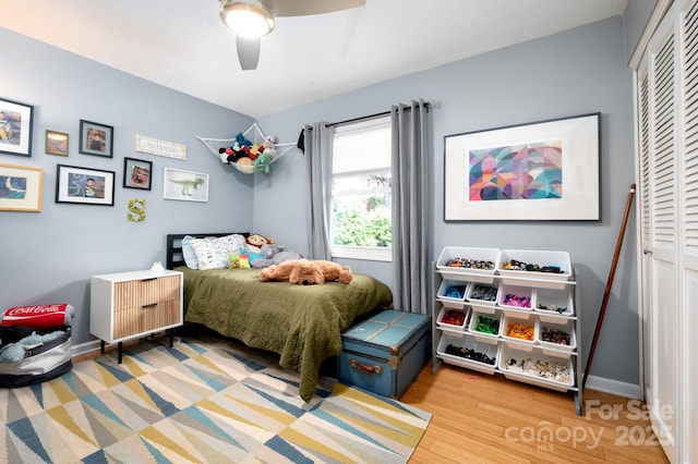 36 Brookcliff Dr, Asheville, NC 28804 - bedroom with ceiling fan, a closet, baseboards, and wood finished floors