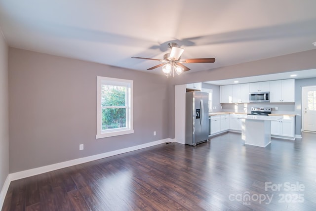 6282 Richburg Rd, Great Falls, SC 29055 - kitchen featuring dark wood finished floors, light countertops, a healthy amount of sunlight, and stainless steel appliances
