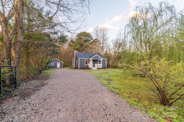 6282 Richburg Rd, Great Falls, SC 29055 - view of front of property with gravel driveway, an outdoor structure, and a chimney