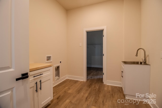 1370 Coppergate Dr, Salisbury, NC 28147 - washroom with hookup for an electric dryer, cabinet space, light wood-style floors, and hookup for a washing machine