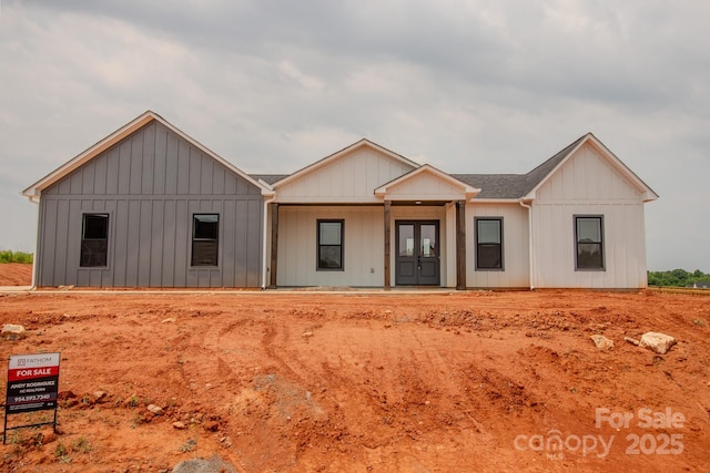 1370 Coppergate Dr, Salisbury, NC 28147 - modern inspired farmhouse featuring board and batten siding, covered porch, and french doors