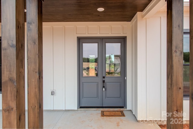 1370 Coppergate Dr, Salisbury, NC 28147 - view of exterior entry featuring french doors and board and batten siding