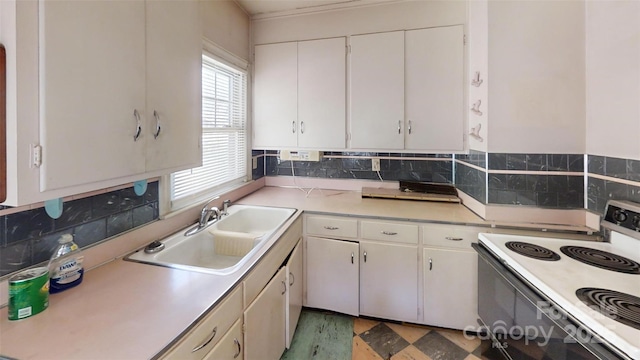 11 Season Ln, Asheville, NC 28805 - kitchen featuring range with electric stovetop, light countertops, white cabinetry, and light wood-style floors