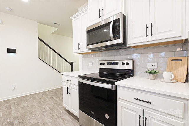 13024 Suncreek Ter, Charlotte, NC 28214 - kitchen with backsplash, light countertops, and stainless steel appliances