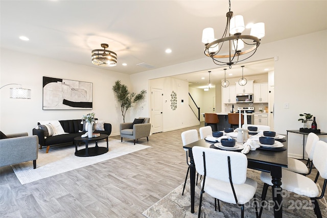 13024 Suncreek Ter, Charlotte, NC 28214 - dining area featuring recessed lighting, light wood finished floors, baseboards, and a notable chandelier