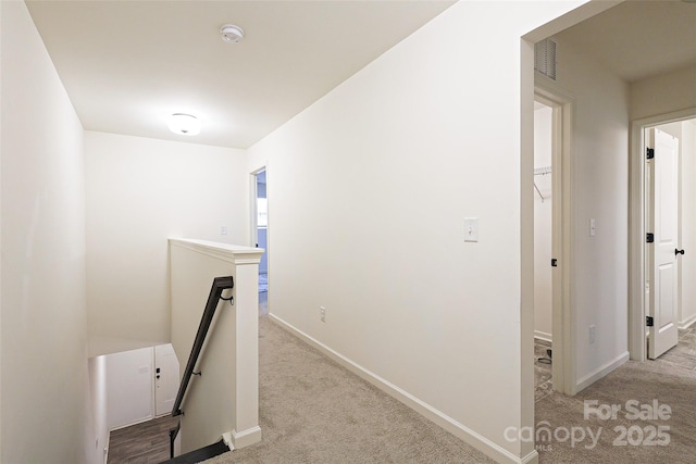 13024 Suncreek Ter, Charlotte, NC 28214 - corridor featuring baseboards, visible vents, light colored carpet, and an upstairs landing