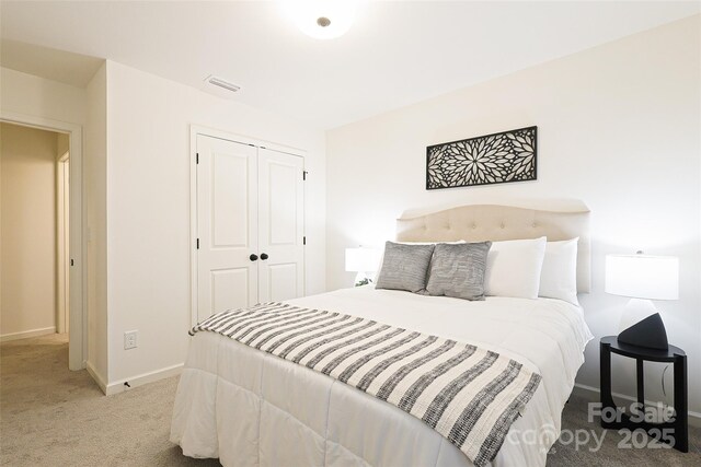 13024 Suncreek Ter, Charlotte, NC 28214 - bedroom with baseboards, carpet flooring, visible vents, and a closet