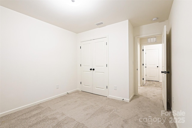 13024 Suncreek Ter, Charlotte, NC 28214 - unfurnished bedroom featuring a closet, carpet flooring, baseboards, and visible vents