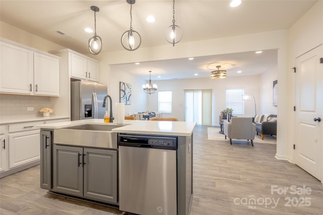 13024 Suncreek Ter, Charlotte, NC 28214 - kitchen featuring appliances with stainless steel finishes, a sink, white cabinetry, and recessed lighting