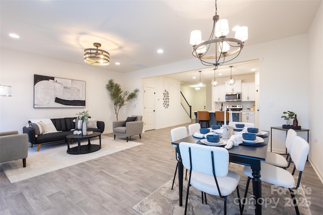 13024 Suncreek Ter, Charlotte, NC 28214 - dining space featuring baseboards, light wood-style flooring, a chandelier, and recessed lighting
