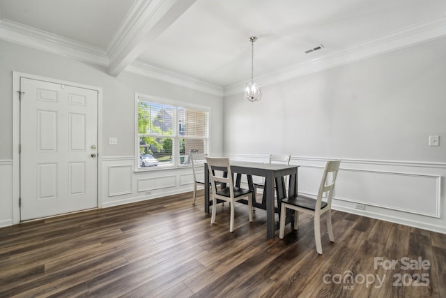 117 Cramerton Mills Parkway, Cramerton, NC 28032 - dining room featuring visible vents, crown molding, a wainscoted wall, a decorative wall, and dark wood-type flooring