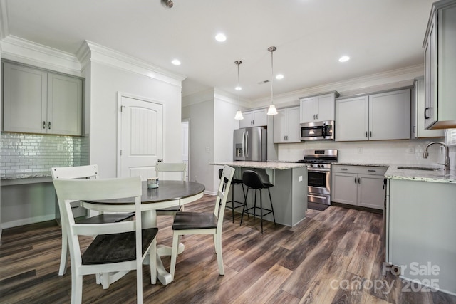 117 Cramerton Mills Parkway, Cramerton, NC 28032 - kitchen featuring a sink, appliances with stainless steel finishes, tasteful backsplash, and gray cabinets