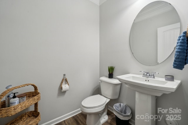 117 Cramerton Mills Parkway, Cramerton, NC 28032 - bathroom featuring baseboards, crown molding, wood finished floors, and toilet